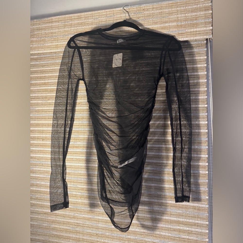 Free People black long-sleeve mesh top